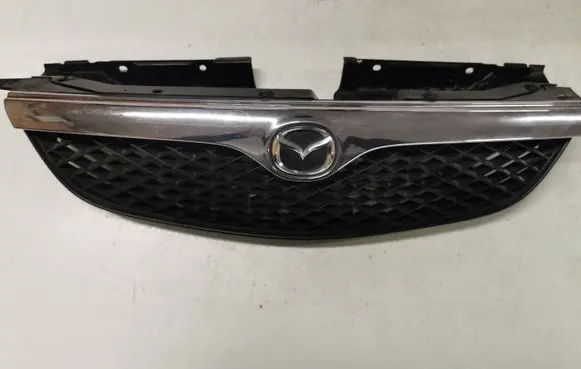 Mazda 626 Front bumper upper radiator grill GE4V50719 GE4T56381