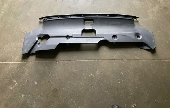 Engine bonnet/hood lock trim molding