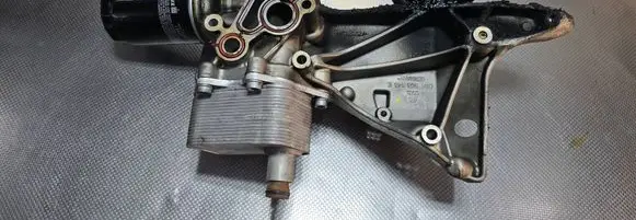 Audi A4 S4 B8 8K Oil filter mounting bracket 06H903143E