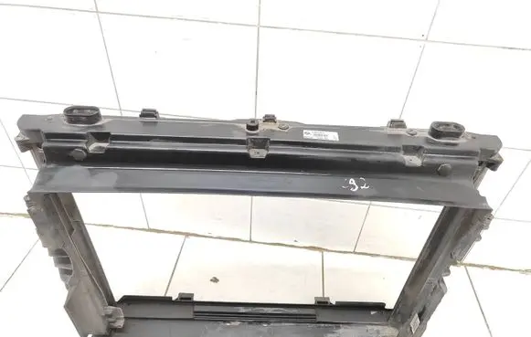 Radiator support slam panel