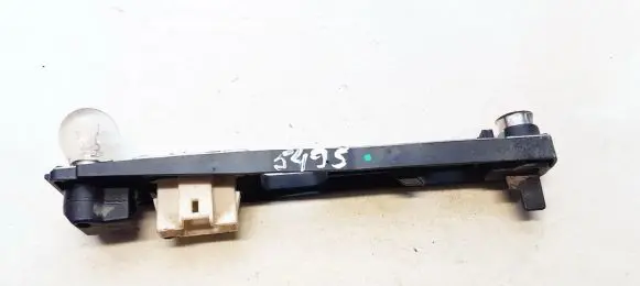 Tail light bulb cover holder
