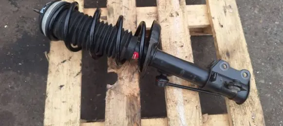Opel Corsa D Front shock absorber with coil spring 