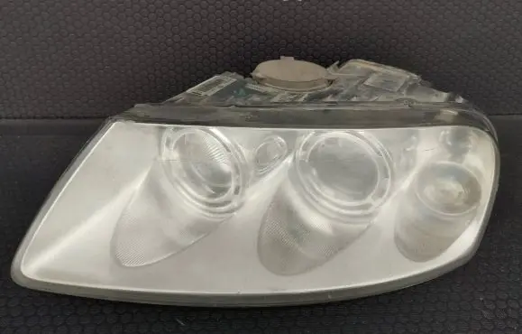 Volkswagen Touareg I Headlight/headlamp 7L6941015BK 89307851 1802A5394
