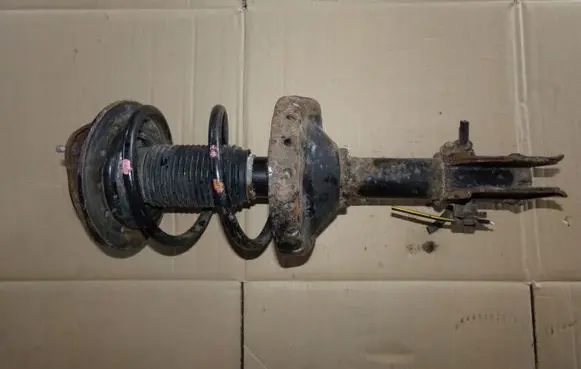 Subaru Legacy Front shock absorber with coil spring