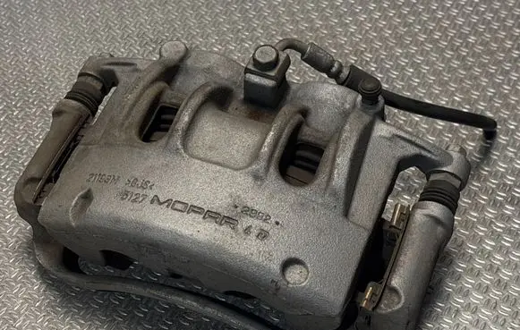 Jeep Grand Cherokee WL Front brake caliper 63358076AB 21193M
