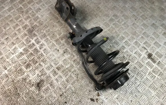 Subaru Legacy Front shock absorber with coil spring