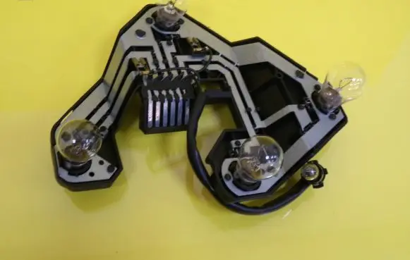 Tail light bulb cover holder