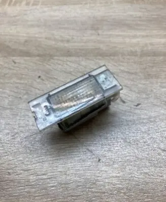 Renault Megane II Number plate light 7700796163
