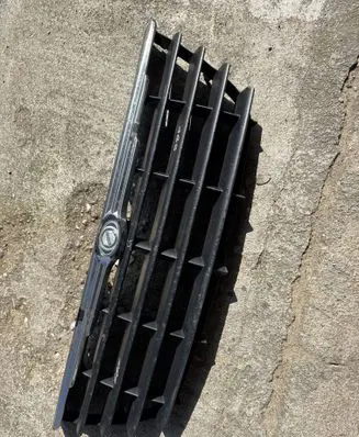 Chrysler Voyager Front bumper upper radiator grill 802500017 04857960 04857960AA