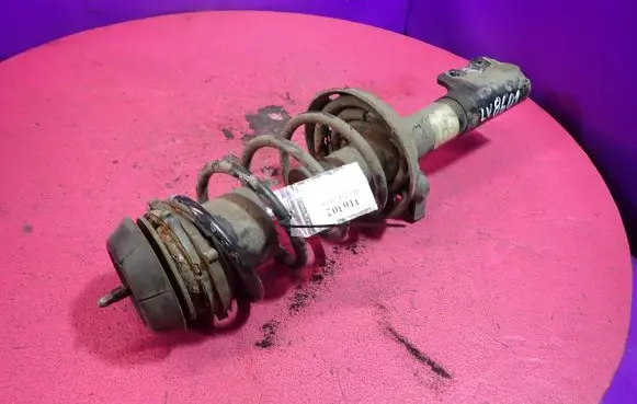 Opel Astra G Front shock absorber with coil spring 90576825