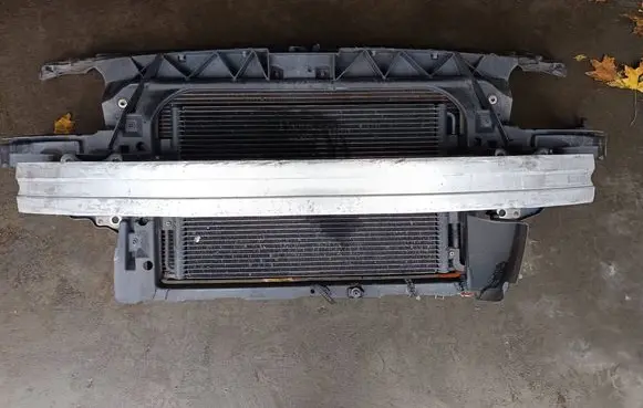 Radiator support slam panel