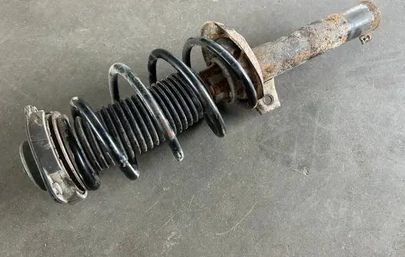 Volkswagen Golf V Front shock absorber with coil spring