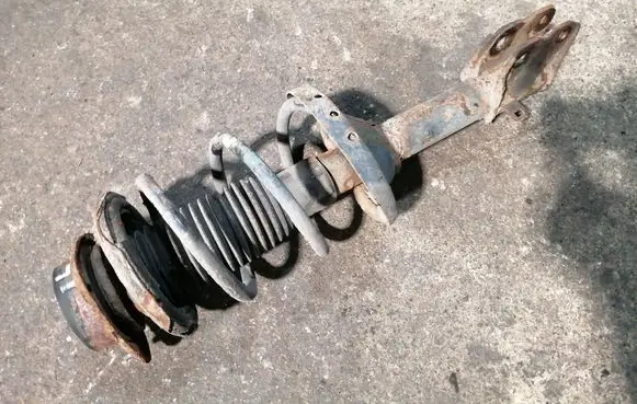 Subaru Outback Front shock absorber with coil spring 
