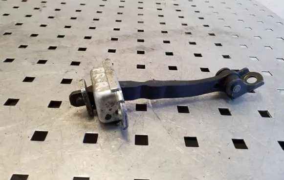 Front door check strap stopper