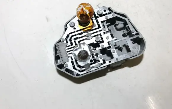 Tail light bulb cover holder