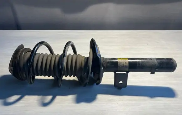 Nissan Qashqai J12 Front shock absorber with coil spring 543026UM2A 1A102060A