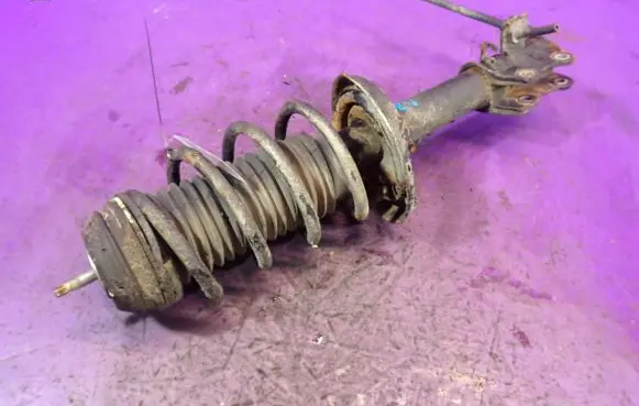 Front shock absorber with coil spring