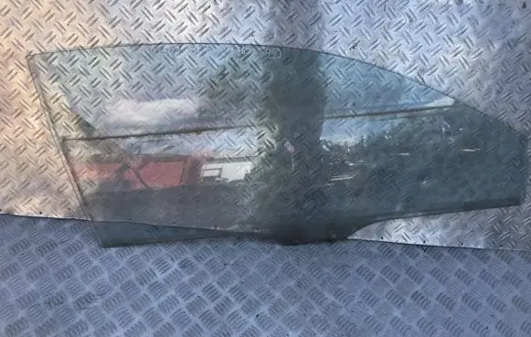 Mazda 323 Front door window glass four-door