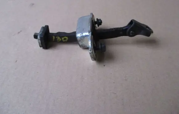 Front door check strap stopper