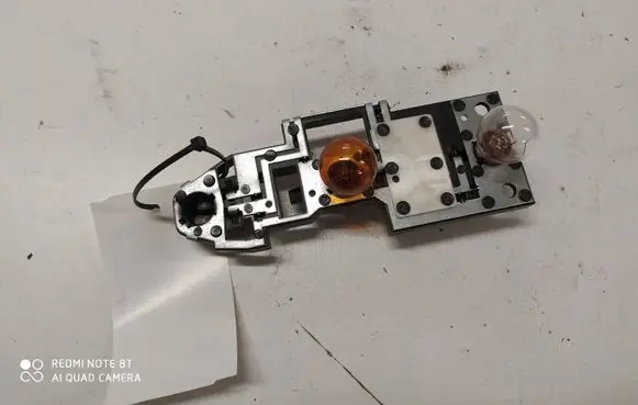 Tail light bulb cover holder