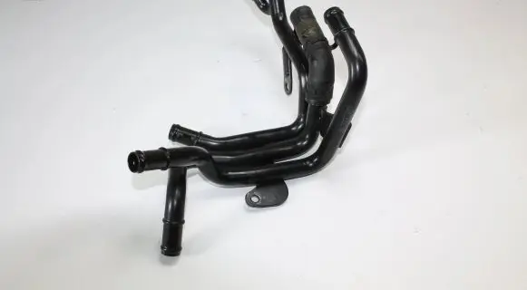 Volkswagen Golf VII Engine coolant pipe/hose 04L121064AM