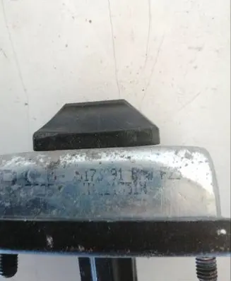 Front door check strap stopper