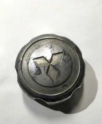 Mitsubishi L200 Original wheel cap MB816581