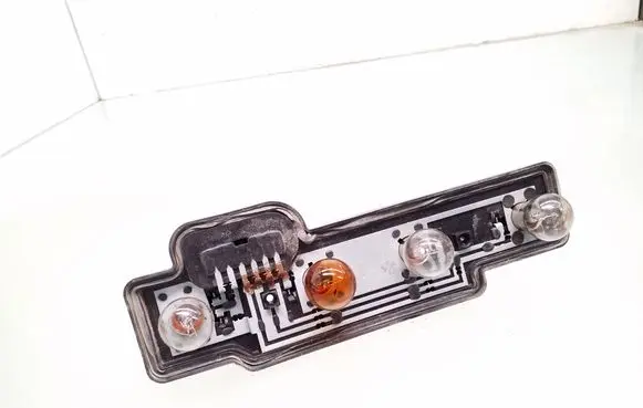 Tail light bulb cover holder