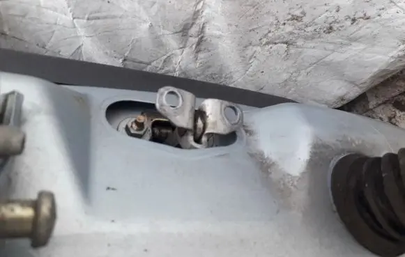 Front door check strap stopper