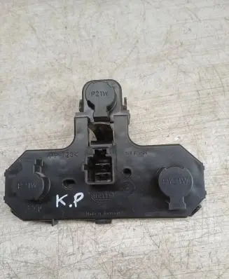 Tail light bulb cover holder