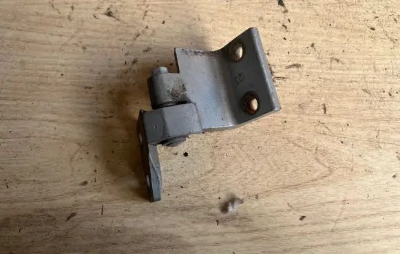 Rear door upper hinge