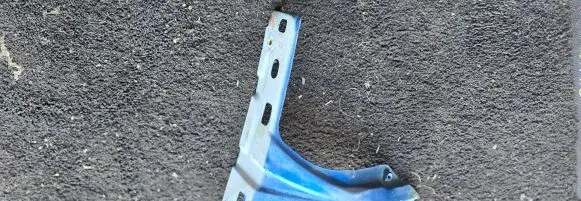 Volkswagen Touran I Fender mounting bracket 1T0821135