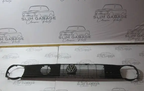 Volkswagen Polo II 86C 2F Front bumper upper radiator grill 867853653