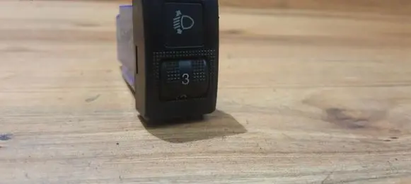 Headlight level height control switch