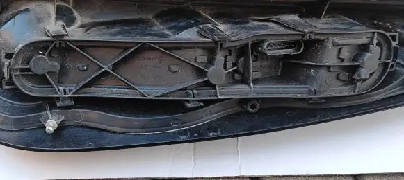 Tail light bulb cover holder