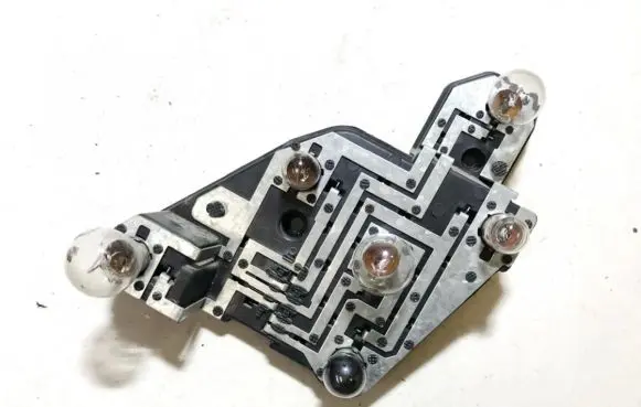 Tail light bulb cover holder