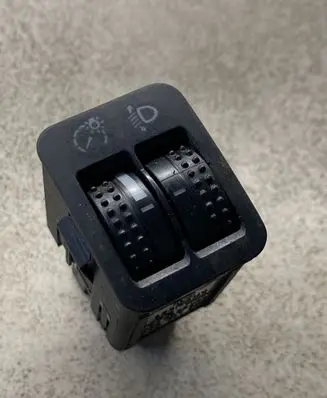 Headlight level height control switch