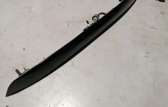 Trunk door license plate light bar