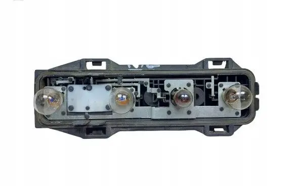 Tail light bulb cover holder