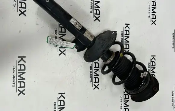 Volkswagen Golf VII Front shock absorber with coil spring 5Q0413023E