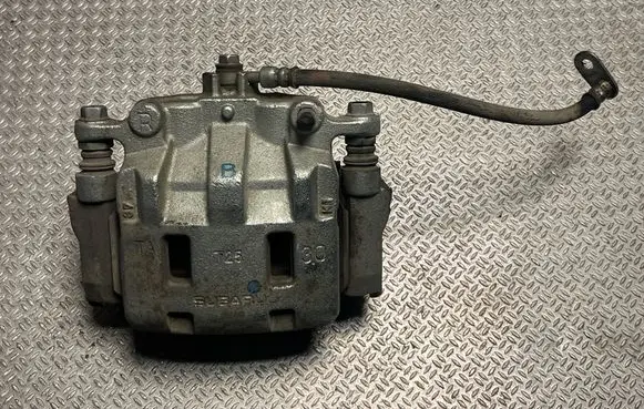 Subaru Outback (BT) Front brake caliper 