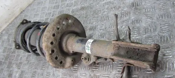 Nissan Juke I F15 Front shock absorber with coil spring