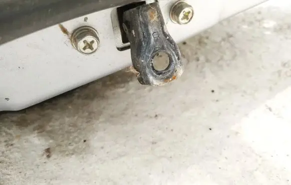 Front door check strap stopper