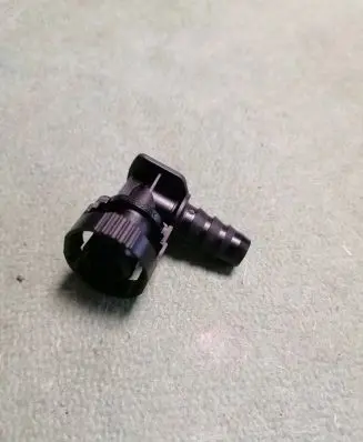 Mitsubishi Pajero Sport I Headlight washer nozzle holder 8265A276