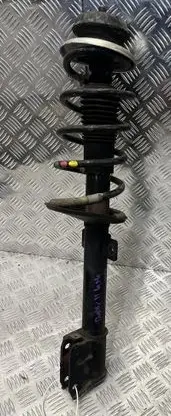Dacia Duster II Front shock absorber with coil spring