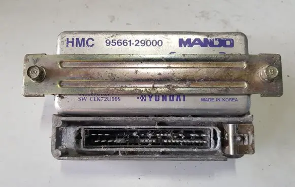 Hyundai Coupe ABS control unit/module 9566129000