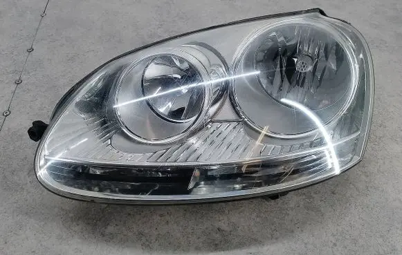 Volkswagen Jetta V Headlight/headlamp 1EG24700717HELLA