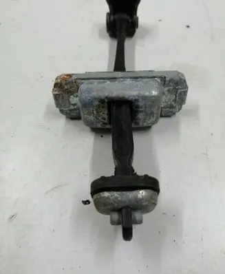 Front door check strap stopper