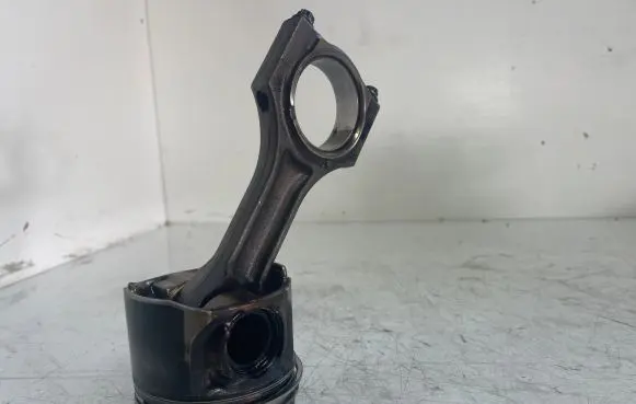 Piston with connecting rod