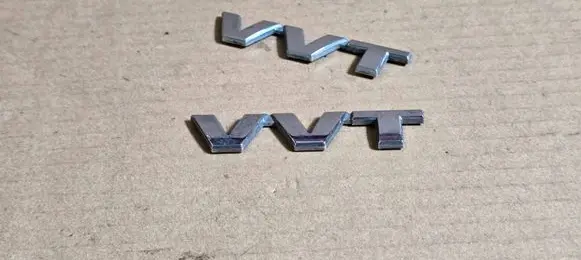 Suzuki Ignis Rear door emblem/model letters 7785154G00
